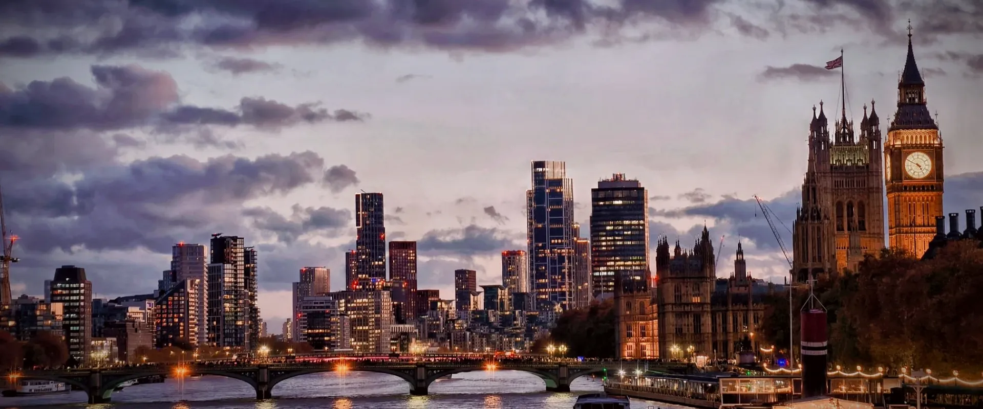 London skyline at dusk across the Thames